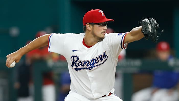 Aug 2, 2021; Arlington, Texas, USA; Texas Rangers starting pitcher Dane Dunning (33) pitches in the first inning against the Los Angeles Angels at Globe Life Field.
